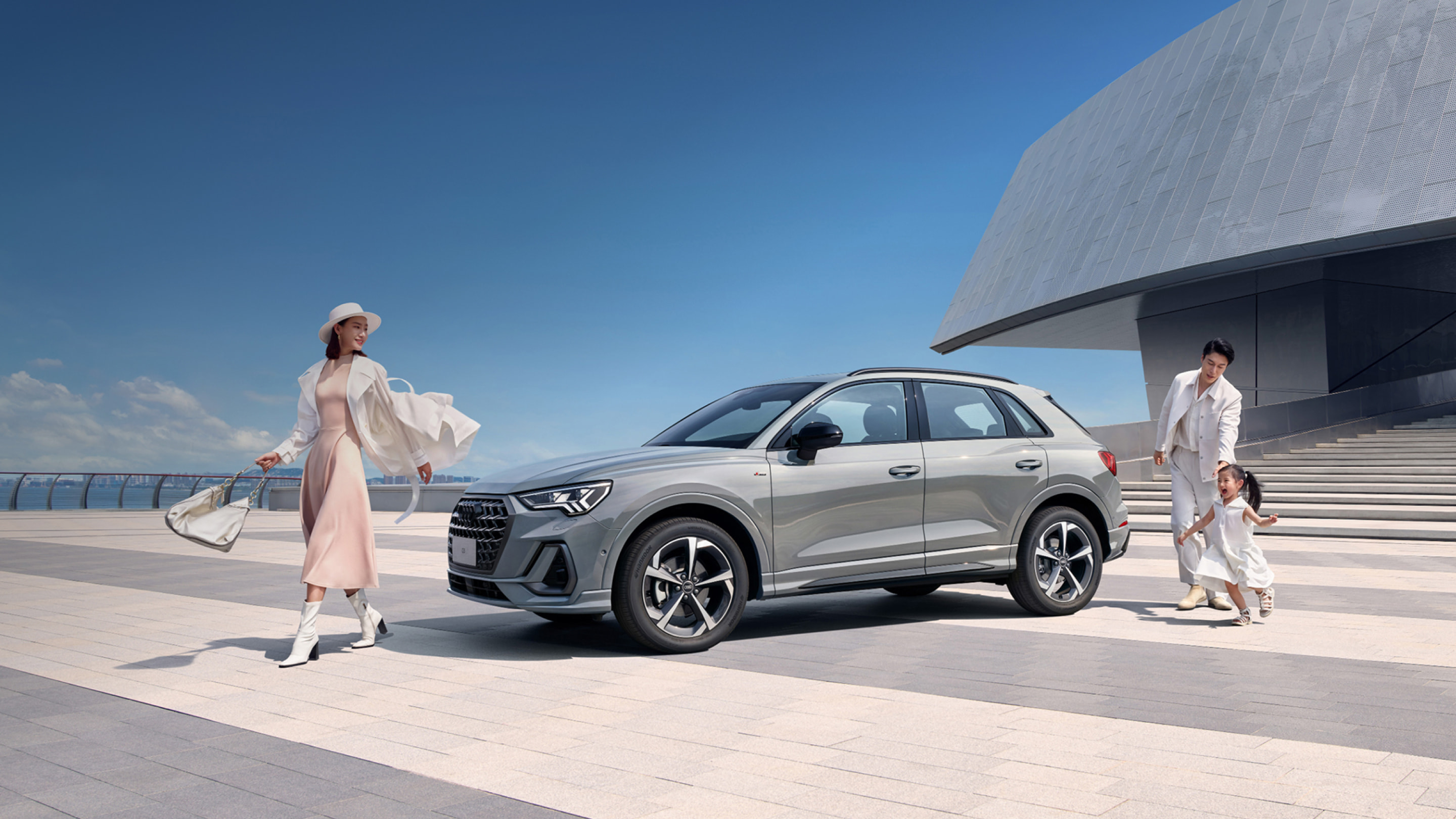 Silver Audi Q3 outside a modern building; representative official China-market image, generation and candidate condition not implied