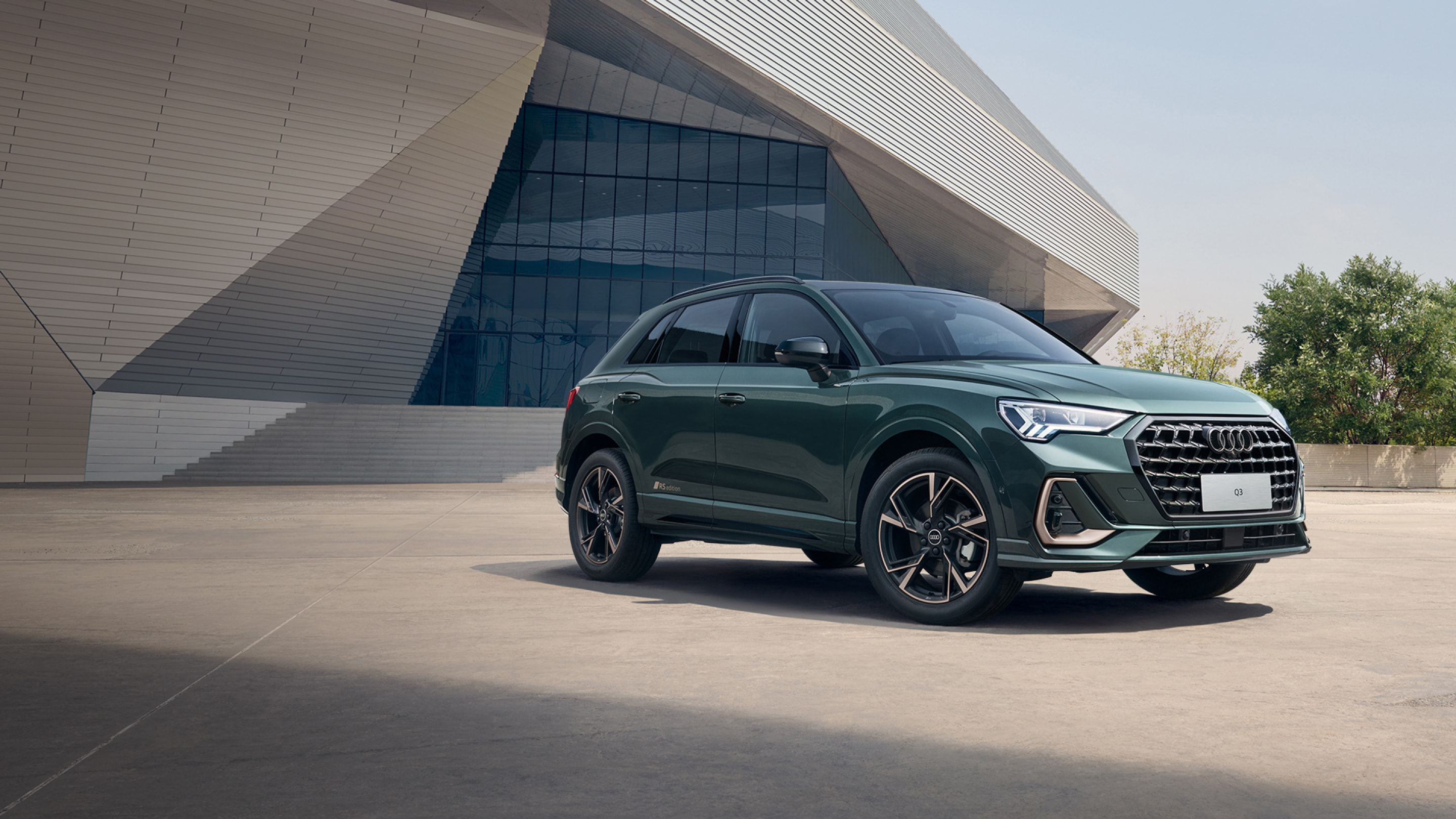 Green Audi Q3 in front three-quarter view; representative official China-market image, generation and candidate condition not implied